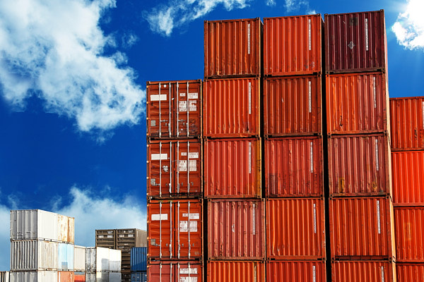 image of shipping containers stacked in a holding yard